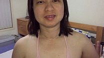 Asian MILF throbs in pink, pleasuring fans on XVideos.
